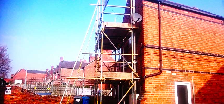 brook scaffoldings sheffield scaffolders erecting scaffold around a bright brick building